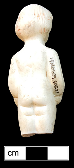 Small Frozen Charlotte doll, with traces of red paint in her hair - from 18MO609.